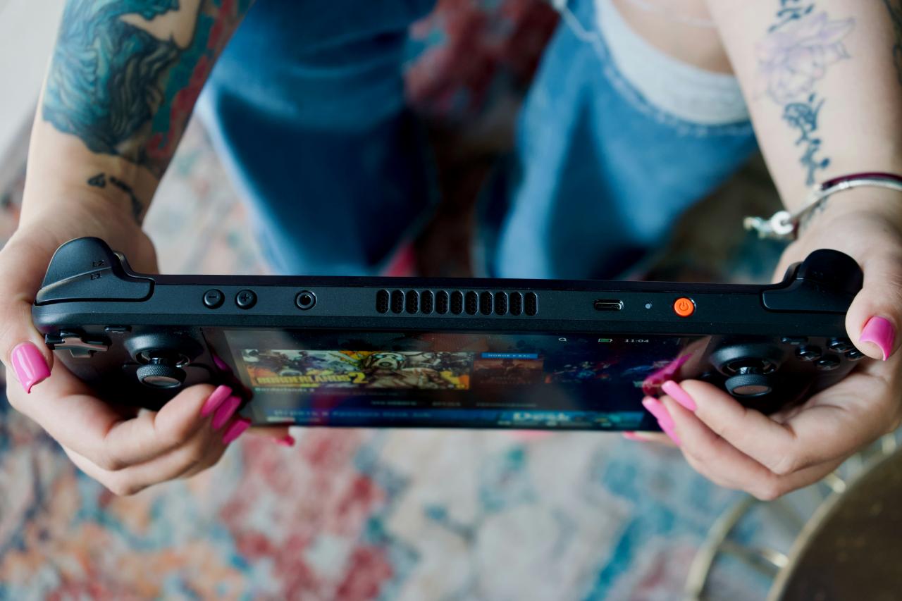 A woman holding a video game controller in her hands